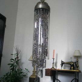 Chandelier in the shape of a glass tube filled with crystal trimmings (smoky glass)